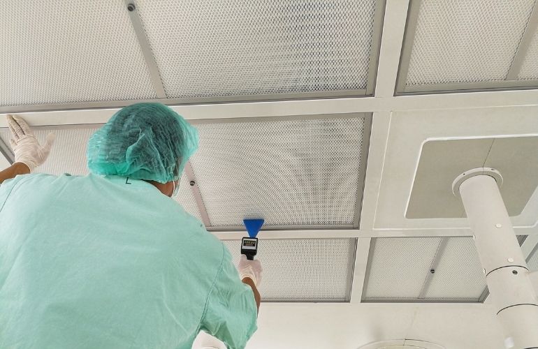 The worker is installing the FFU Unit